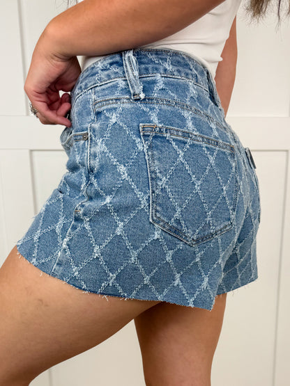 Short Saige Linda en jean bleu délavé taille haute et ourlet brut