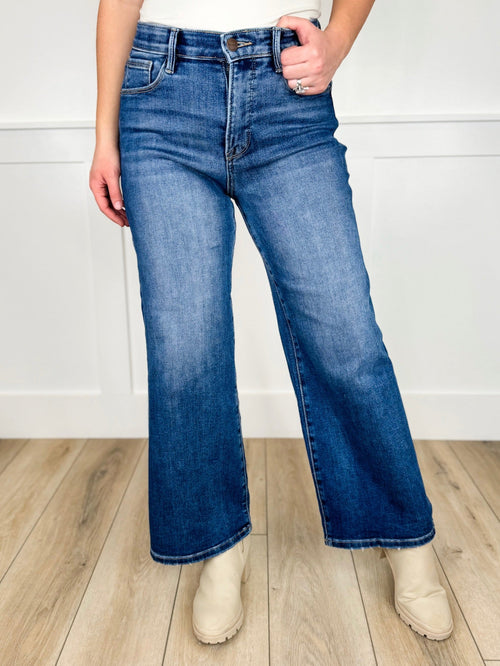 Jean large en denim foncé Risen Maeve taille haute avec contrôle du ventre et ourlet effiloché